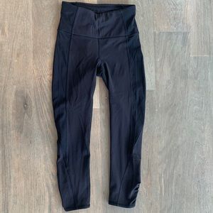 Lulu lemon black 21” tights. Tag cut out but they are a size 4.